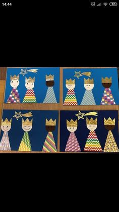 four paper dolls with crowns on them sitting on a wooden table in front of a black background