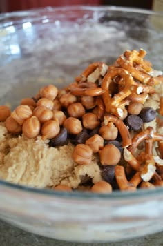 a glass bowl filled with nuts and ice cream