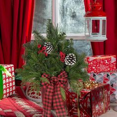 a christmas arrangement with pine cones and presents