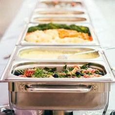 a buffet line with different types of food