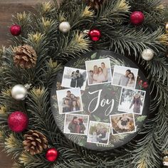 a christmas wreath with photos and ornaments around it