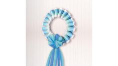 a blue ribbon is hanging on the wall