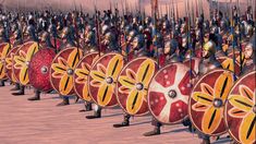 a group of men in armor standing next to each other with shields and swords on their heads