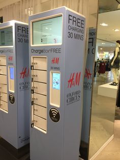 two white vending machines sitting next to each other