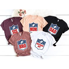 four shirts with the words, sis and dad on them in red, white, and blue