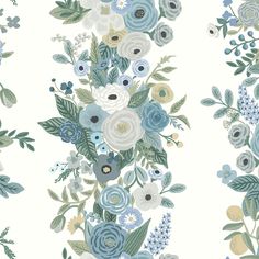 a floral wallpaper with blue flowers and green leaves on the bottom half of it