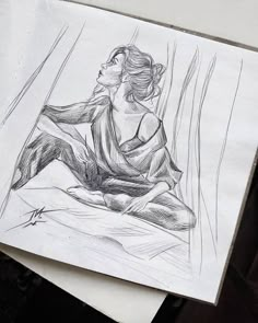 a drawing of a woman sitting on the ground