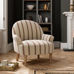 a striped chair in front of a fireplace