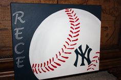 a close up of a baseball painted on a wall