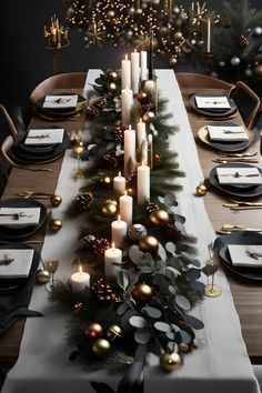 a long table with candles, plates and napkins set for christmas dinner in front of a decorated tree