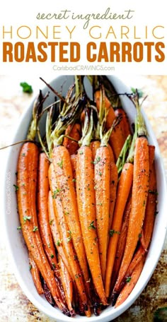 roasted carrots in a white bowl with herbs on top and text overlay that reads secret ingredient honey garlic roasted carrots