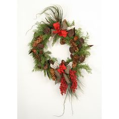 a christmas wreath with pine cones and red berries