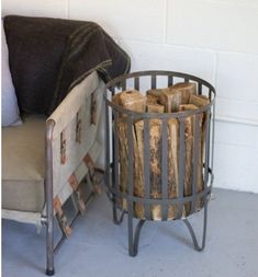 a chair sitting next to a firewood log holder