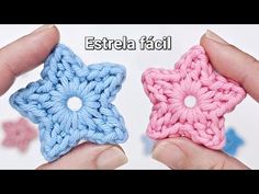 two small crocheted stars are being held in their hands