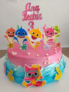 a birthday cake decorated with cartoon characters