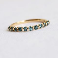 a gold ring with blue stones on it