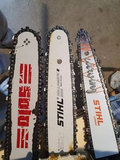 three snow skis sitting next to each other