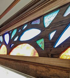 the stained glass windows in this house are made from wood and have different designs on them