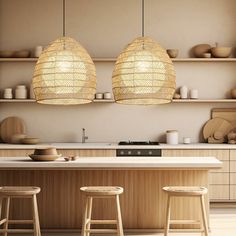 two bamboo lights hanging over a kitchen island with stools and counter tops in front of it