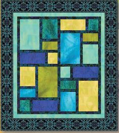 a blue, yellow and green quilt with squares in the center on top of it