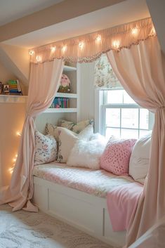 a window seat with pillows and lights on the windowsill