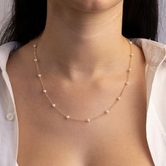 Our elegant pearl station necklace features a ball chain and hand selected natural pearls set alongside the chain. ★ Necklace Features • Gold Kt: 14K Solid Gold - All pieces are stamped for authenticity• Available Gold Colors: Yellow Gold• Ball Chain Width: 1.15 mm• Approximate Pearl Diameters: 4.2 mm / 0.17 Inch• We only work with real freshwater pearls Pearl Chains Indian Gold, Pearl Chain Designs In Gold, Modern Pearl Necklace, Gold Ball Chain, Pearl Rings Vintage, Dainty Pearl Necklace, Natural Pearl Necklace, Gold Diamond Earrings Studs, Statement Rings Diamond