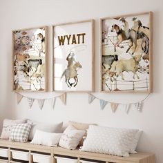 three framed pictures hang on the wall above a wooden bench with pillows and pillow cases