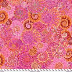 an orange and pink pattern on fabric