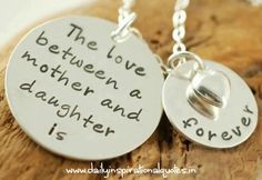 the love between a mother and daughter is forever necklaces on a piece of wood