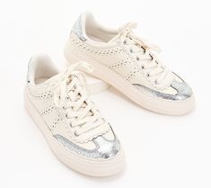 This casual chic leather sneaker adds panache to loungewear on laidback days. Plus, the neutral color combo and platform sole elevate the look. From Vince Camuto. Trendy Cream Sneakers With Perforated Toe Box, Casual Cream Sneakers With Studded Outsoles, Trendy Platform Sneakers With Perforations, Trendy Spring Platform Sneakers With Perforations, Chic Leather Sneakers With Perforations, Chic Low-top Sneakers With Perforations, Chic Sneakers With Perforated Toe Box, Chic Lace-up Sneakers With Contrast Sole, Vince Sneakers