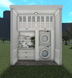 an open refrigerator with two washers and a dryer in the door on grass