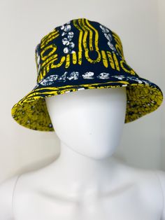 "Elevate your style with this handcrafted Ankara reversible bucket hat, featuring vibrant African prints on both sides for a versatile and eye-catching look. Made from high-quality cotton fabric, this hat is perfect for adding a splash of color to your outfits while providing sun protection. Whether you're at the beach, festival, or running errands, this lightweight and breathable accessory is designed for comfort and durability. The reversible design offers two bold looks in one, making it a mu Beach Festival, Reversible Bucket Hat, African Prints, Bucket Hats, African Print, Fashion Lover, At The Beach, Running Errands, Ankara