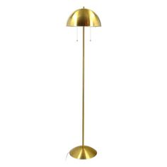 a gold floor lamp on a white background with the light turned off and it's shade