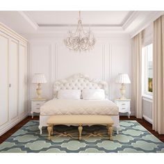 a bedroom with white furniture and chandelier