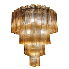 Elegant Murano chandelier. The warm amber color vibrates with shades of gold, the effect is magnetic and sophisticated. The height without chain is 112 cm. It can be made to the dimensions requested by the customer. Murano Chandelier, Italian Chandelier, Shades Of Gold, Amber Color, Chandeliers And Pendants, Chandelier Pendant Lights, Vintage Italian, Murano Glass, Chandelier Lighting