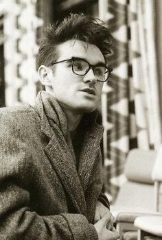 black and white photograph of a man wearing glasses