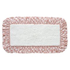 a pink and white rug with ruffled edges