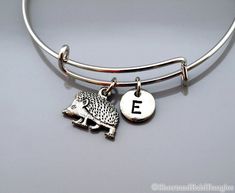 "❖ Hedgehog Charm: Antique Silver Pewter. Approx: 6/8 X 1/2\" ❖ Hand Stamped Initial Charm - Antique silver pewter 3/8\" (9mm) ❖ Bangle: Silver plated metal (Expandable) Dimension: Approx. 2.5\" (6.4 cm) - Expands to 3\" (7.6 cm) ❖ Click below for Hedgehog bangle in gold: https://www.etsy.com/listing/1140089368 ❖ Add a birthstone or freshwater pearl $3.50 each: https://www.etsy.com/listing/110444872 ❖ Additional Hand Stamped Initial charms $4.50 each: https://www.etsy.com/listing/107021419 ❖ Go Hedgehog Accessories, Hedge Hog, Bracelet Initial, Bangle Silver, Personalized Bracelet, Initial Bracelet, Personalized Bracelets, Bracelet Charm, Charm Bangle