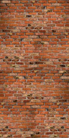 an old brick wall that has been painted red