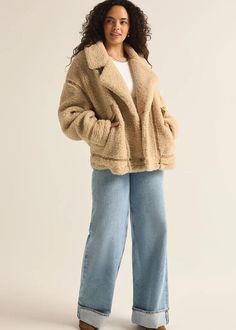 Wrap yourself in comfort with this jacket, made from plush short-haired sherpa jacket accented with faux leather trim details. Featuring a collared, button front design and pockets, combining a classic cozy feel with modern style. Collared. Long sleeve. Button front. Flap pocket. Heavyweight Plush sherpa. Regular fit. Short Haired Faux Sherpa: 100% Polyester. Faux leather trim detail. Model is wearing a size S. Fall Collared Outerwear With Faux Fur Lining, Casual Faux Fur Coat With Faux Fur Lining, Chic Outerwear With Faux Fur Lining And Lapel Collar, Trendy Sherpa Outerwear With Faux Fur Lining, Cozy Fall Outerwear With Faux Fur Trim, Trendy Fall Sherpa Outerwear, Trendy Sherpa Outerwear For Fall, Chic Outerwear With Faux Fur Trim And Lapel Collar, Trendy Fur Coat With Pockets For Cold Weather