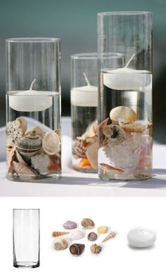 three glass vases filled with seashells and candles