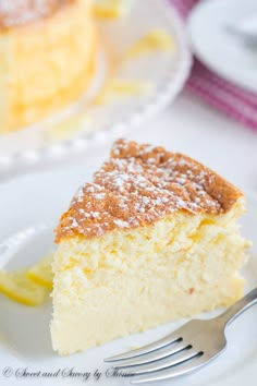 a slice of lemon cake on a plate with a fork