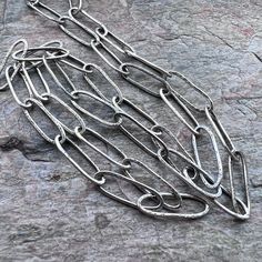 I make these elongated cable chains entirely by hand from pure sterling silver.  I form, solder, and texture each link one at a time.  I then make handmade hook clasps to finish the chains.  This chain is available with either 2 handmade hook clasps (one on each end) or 1 handmade hook & eye clasp.   Be sure to see all photos and video for size and finish reference. Select your desired clasp choice, silver finish, and total necklace length when ordering.  Length includes clasp(s). Each chain lin Mystic Quartz, Pendant Bails, Silver Chain Style, Sterling Silver Chain Necklace, Handmade Wire Jewelry, Hook Clasp, Quartz Pendant, Silver Chain Necklace, Turquoise Pendant