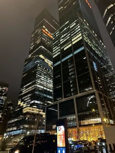 a very tall building with lots of windows at night