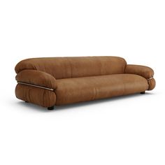 a brown couch sitting on top of a white floor