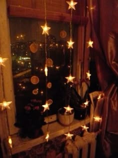 a window with stars hanging from it's side