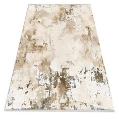 an area rug with white and brown paint on the top, in front of a white background