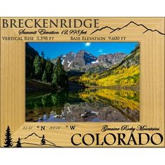 a wooden frame with the words breckenridge on it and mountains in the background