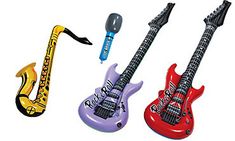 three electric guitars are lined up next to each other, one has a microphone and the other is a guitar