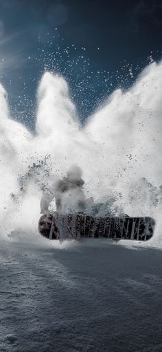 a snowboarder is in mid air on a snowy slope with white foam coming out of his feet